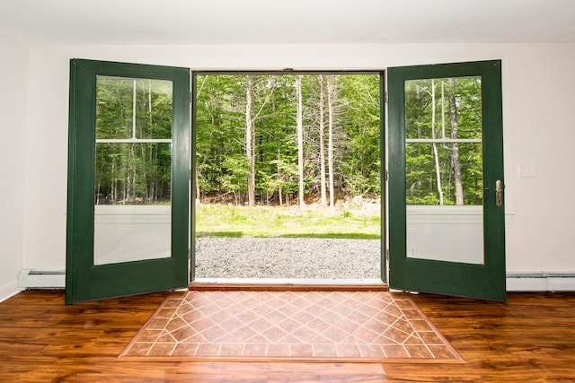 10 Pemasong Ln, Yarmouth, ME 04096 - doorway to outside with a baseboard heating unit and wood finished floors