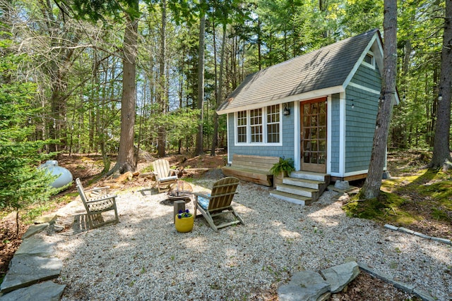 10 Pemasong Ln, Yarmouth, ME 04096 - view of outbuilding with an outdoor fire pit and entry steps