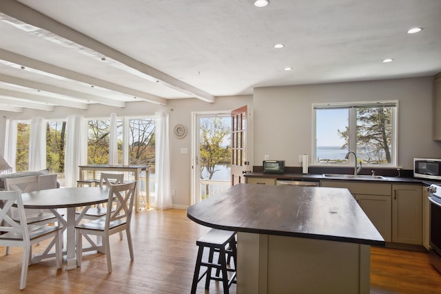 142 Fortunes Rocks Rd, Biddeford, ME 04005 - kitchen featuring appliances with stainless steel finishes, a sink, recessed lighting, a center island, and beam ceiling