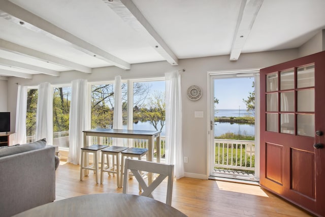 142 Fortunes Rocks Rd, Biddeford, ME 04005 - foyer with beam ceiling, a water view, light wood finished floors, and healthy amount of natural light
