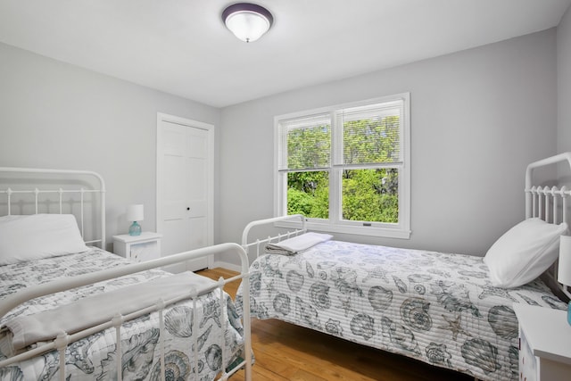 142 Fortunes Rocks Rd, Biddeford, ME 04005 - bedroom featuring wood finished floors, a closet, and baseboards