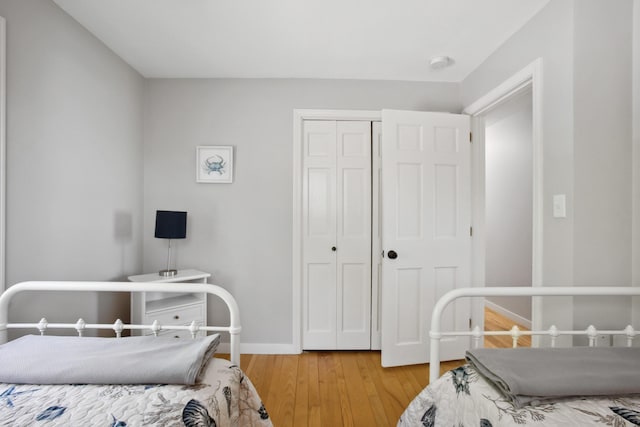 142 Fortunes Rocks Rd, Biddeford, ME 04005 - bedroom featuring light wood-type flooring, baseboards, and a closet