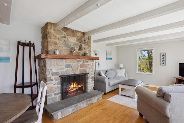 142 Fortunes Rocks Rd, Biddeford, ME 04005 - living area featuring a stone fireplace, hardwood / wood-style flooring, beam ceiling, and a baseboard heating unit