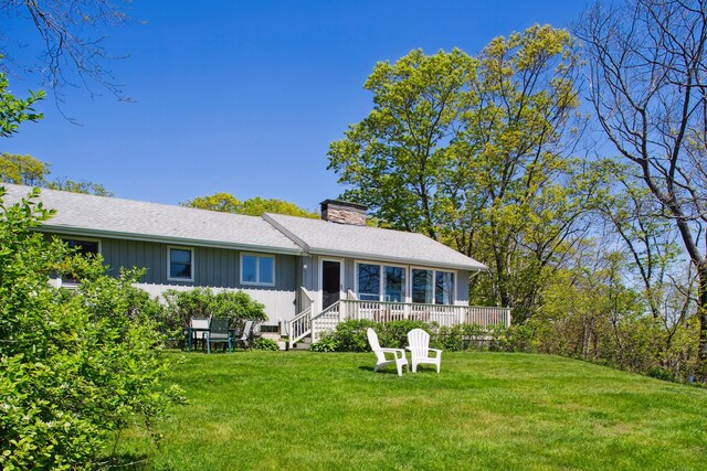 142 Fortunes Rocks Rd, Biddeford, ME 04005 - single story home with a chimney, a front yard, roof with shingles, and board and batten siding