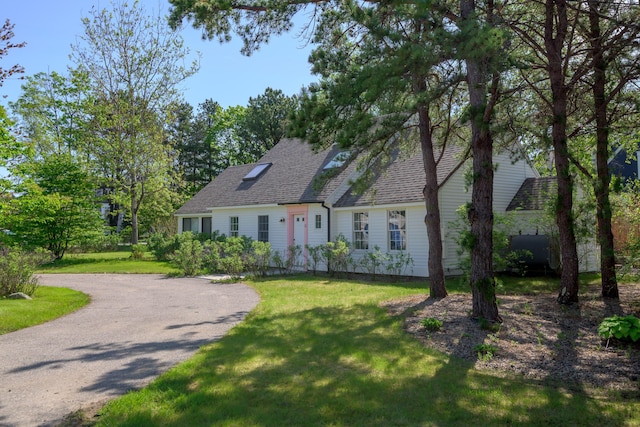 21 Surf Ln, Kennebunk, ME 04043 - cape cod home featuring a front yard, roof with shingles, and driveway