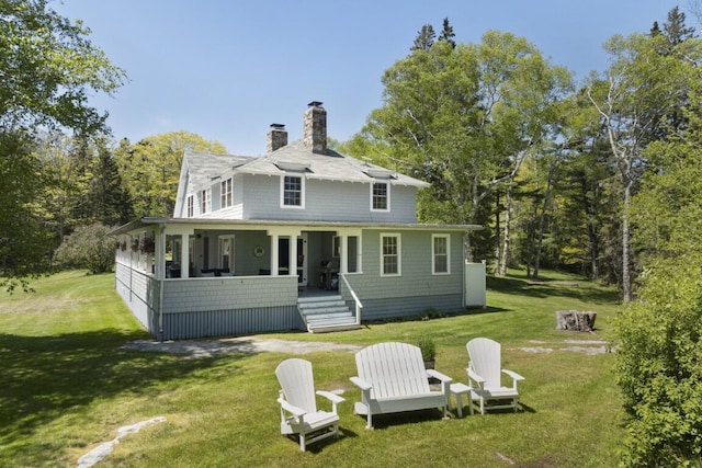 1 Mouse Is, Southport, ME 04576 - rear view of house with a chimney and a lawn