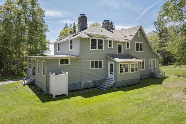 1 Mouse Is, Southport, ME 04576 - back of property featuring a chimney, entry steps, and a lawn