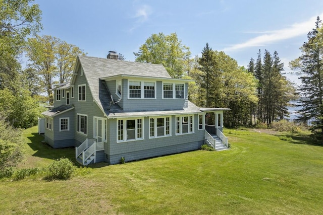 1 Mouse Is, Southport, ME 04576 - rear view of property featuring a yard, a chimney, and roof with shingles