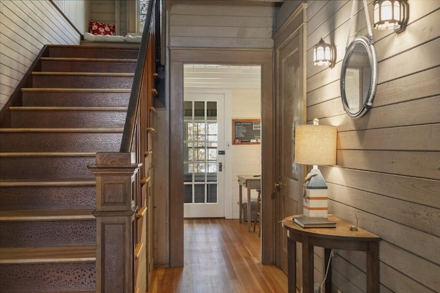 1 Mouse Is, Southport, ME 04576 - staircase with wooden walls and hardwood / wood-style flooring