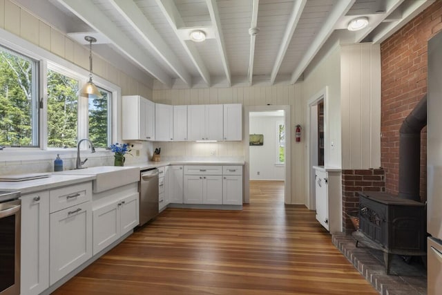 1 Mouse Is, Southport, ME 04576 - kitchen with dishwasher, a sink, dark wood-style floors, beam ceiling, and light countertops