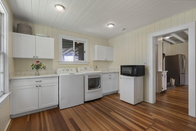 1 Mouse Is, Southport, ME 04576 - laundry area with washer and clothes dryer, dark wood-style floors, wooden walls, cabinet space, and wooden ceiling