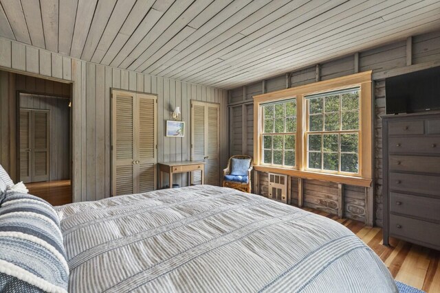 1 Mouse Is, Southport, ME 04576 - bedroom with wooden walls, wood ceiling, wood finished floors, and a closet