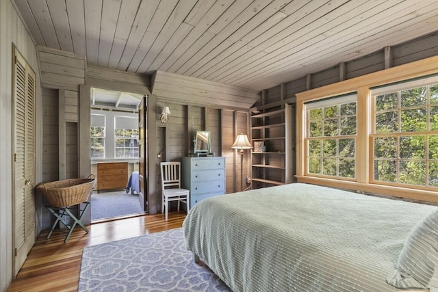 1 Mouse Is, Southport, ME 04576 - bedroom featuring wooden walls, wood finished floors, wood ceiling, and multiple windows