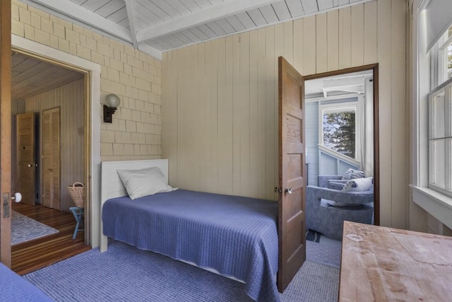 1 Mouse Is, Southport, ME 04576 - bedroom with wooden walls, beamed ceiling, and wood finished floors