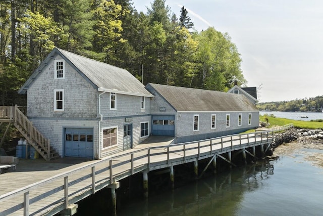 1 Mouse Is, Southport, ME 04576 - back of property with a deck with water view, an attached garage, stairs, and a shingled roof