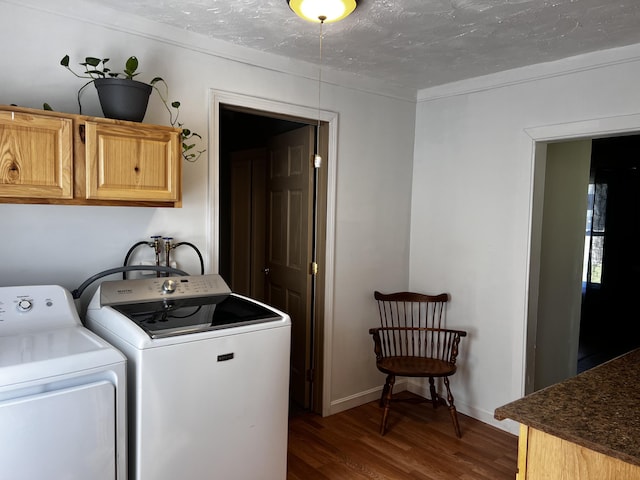 30 Highland Ave, Dixfield, ME 04224 - laundry area featuring cabinet space, washer and dryer, wood finished floors, a textured ceiling, and baseboards