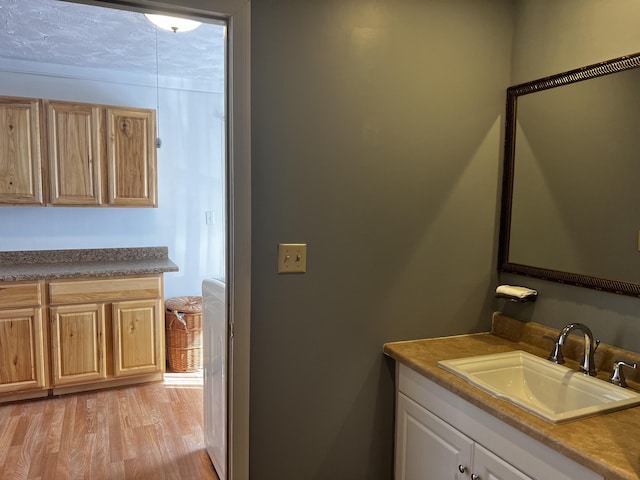 30 Highland Ave, Dixfield, ME 04224 - bathroom featuring vanity and wood finished floors