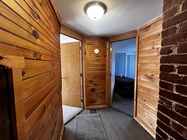 30 Highland Ave, Dixfield, ME 04224 - hallway with wooden walls and dark wood-style floors