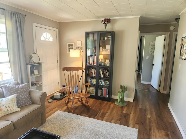 65 Pearce Ave, Houlton, ME 04730 - living area with crown molding, dark wood finished floors, and baseboards
