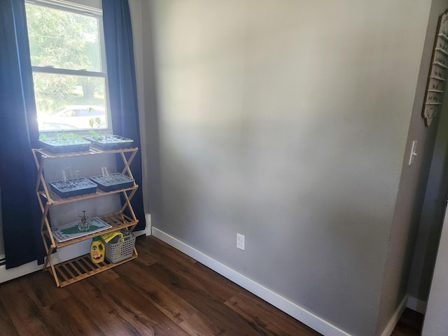 65 Pearce Ave, Houlton, ME 04730 - misc room with baseboards and dark wood-style flooring