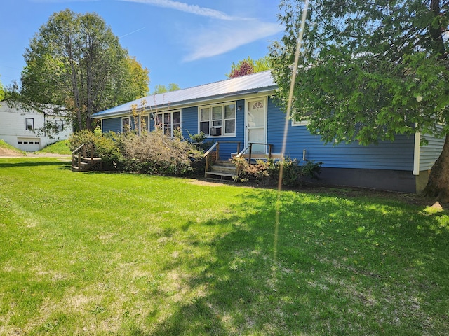 65 Pearce Ave, Houlton, ME 04730 - ranch-style home featuring a front lawn and metal roof