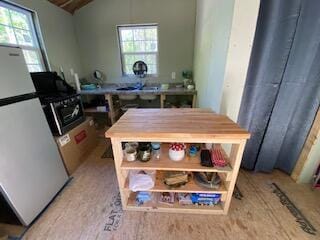 254 Eaton Rd, Dexter, ME 04435 - kitchen with freestanding refrigerator and vaulted ceiling