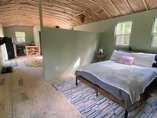 254 Eaton Rd, Dexter, ME 04435 - carpeted bedroom featuring vaulted ceiling