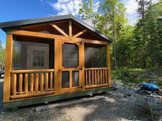 254 Eaton Rd, Dexter, ME 04435 - view of outdoor structure with a sunroom