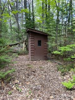 254 Eaton Rd, Dexter, ME 04435 - view of shed featuring a wooded view