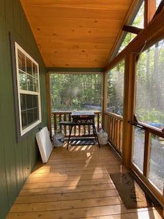 254 Eaton Rd, Dexter, ME 04435 - sunroom / solarium featuring vaulted ceiling, wood ceiling, wood-type flooring, and healthy amount of natural light