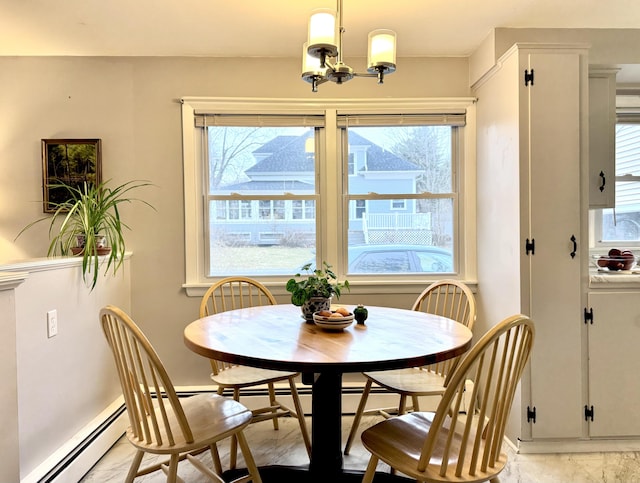 51 Francis St, Waterville, ME 04901 - dining area featuring a chandelier, baseboards, and a baseboard heating unit