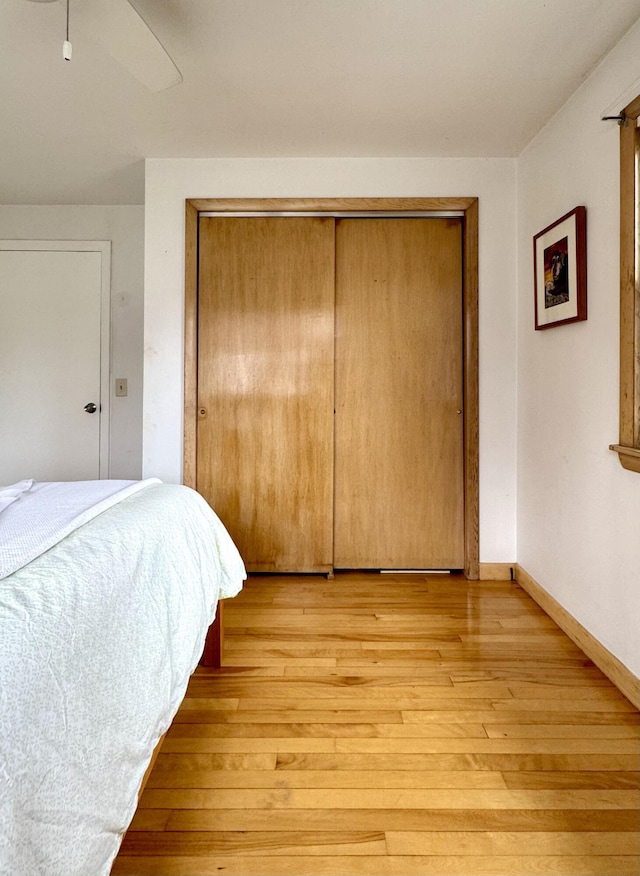 51 Francis St, Waterville, ME 04901 - bedroom featuring light wood finished floors, a closet, baseboards, and ceiling fan