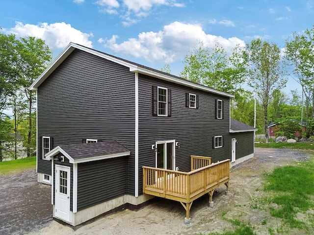 65 May Way, Sidney, ME 04330 - back of property with a wooden deck