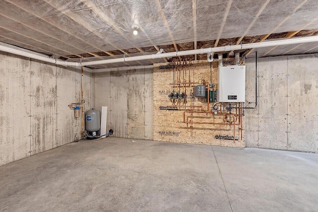 65 May Way, Sidney, ME 04330 - unfinished basement featuring water heater and a water pressure tank