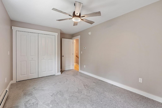 65 May Way, Sidney, ME 04330 - unfurnished bedroom featuring a baseboard radiator, carpet, baseboards, a closet, and ceiling fan