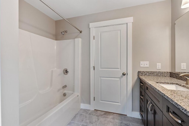 65 May Way, Sidney, ME 04330 - bathroom featuring vanity, bathing tub / shower combination, and baseboards