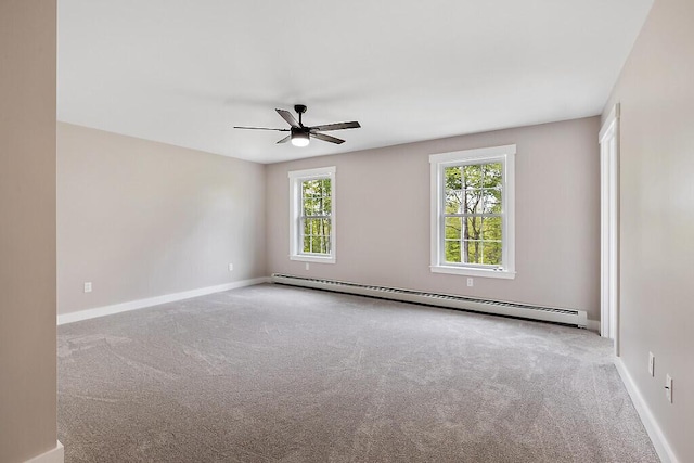 65 May Way, Sidney, ME 04330 - carpeted empty room with baseboard heating, plenty of natural light, ceiling fan, and baseboards