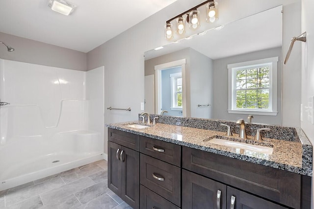 65 May Way, Sidney, ME 04330 - full bathroom with double vanity and a shower