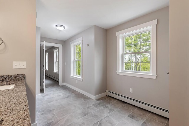 65 May Way, Sidney, ME 04330 - foyer entrance featuring a baseboard radiator, plenty of natural light, and baseboards