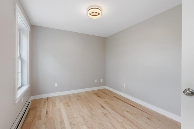 65 May Way, Sidney, ME 04330 - spare room featuring a baseboard radiator, wood finished floors, and baseboards