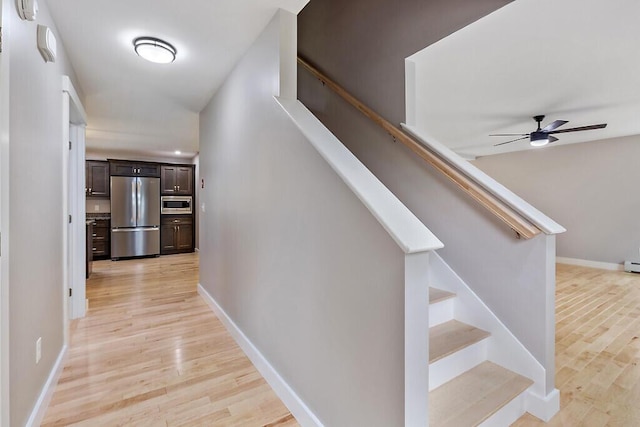 65 May Way, Sidney, ME 04330 - staircase featuring wood finished floors, a ceiling fan, and baseboards