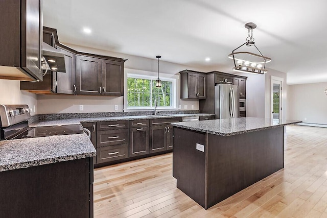 65 May Way, Sidney, ME 04330 - kitchen with appliances with stainless steel finishes, a sink, dark brown cabinetry, light wood-style flooring, and hanging light fixtures