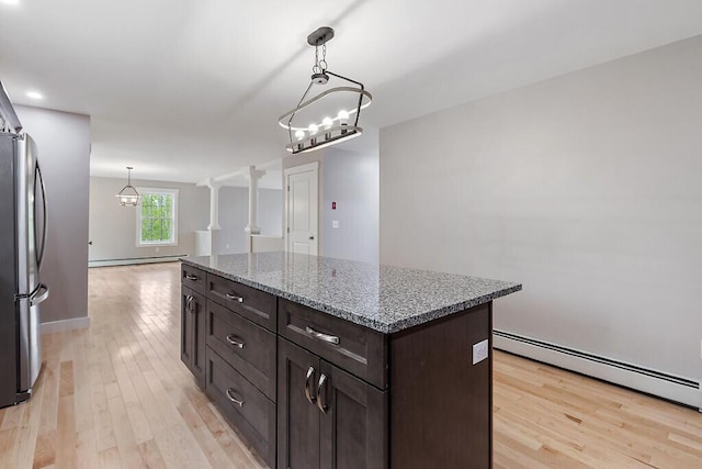 65 May Way, Sidney, ME 04330 - kitchen featuring freestanding refrigerator, a chandelier, light wood finished floors, and dark brown cabinetry