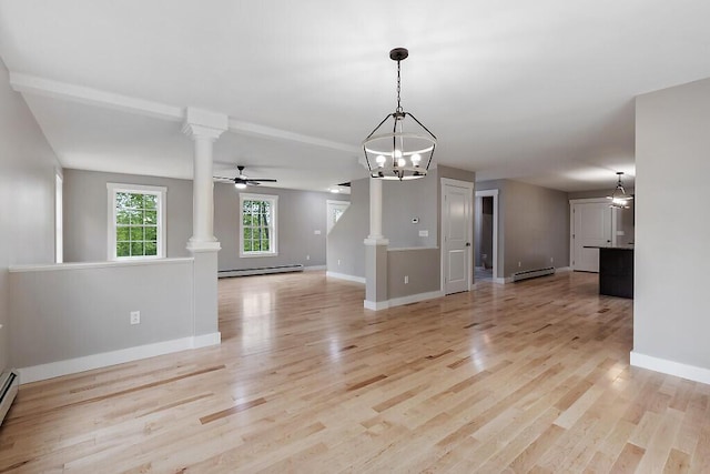 65 May Way, Sidney, ME 04330 - unfurnished living room with decorative columns, a chandelier, a baseboard heating unit, and baseboards