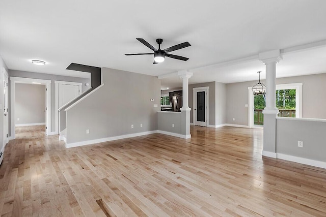 65 May Way, Sidney, ME 04330 - unfurnished living room featuring ornate columns, ceiling fan, light wood-style flooring, and baseboards