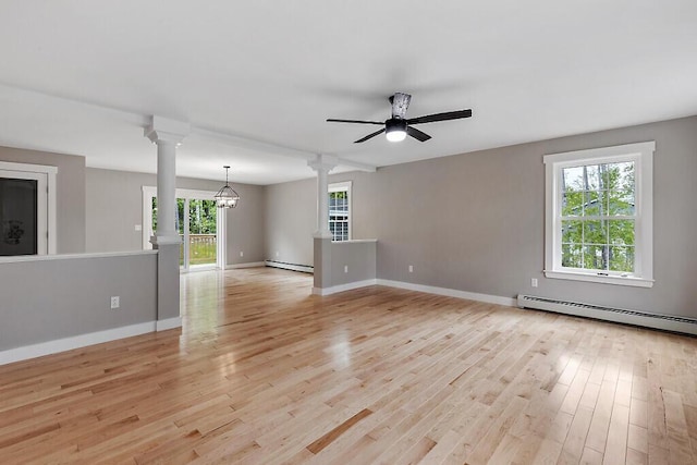 65 May Way, Sidney, ME 04330 - unfurnished room featuring decorative columns, a baseboard heating unit, light wood-style floors, and baseboards