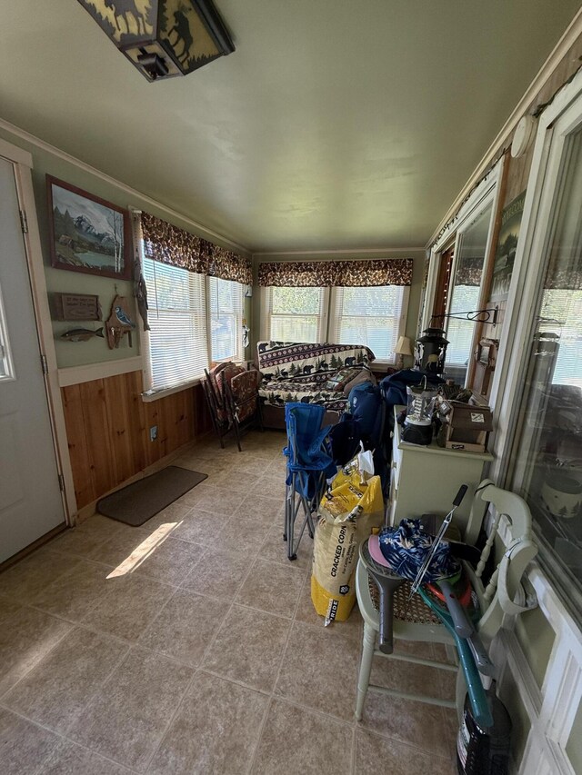 10 Rachel Ln, Rangeley, ME 04970 - sunroom with healthy amount of natural light, wainscoting, and wood walls
