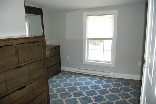 30 Westland Ave, Biddeford, ME 04005 - unfurnished bedroom featuring a baseboard heating unit, baseboards, and multiple windows
