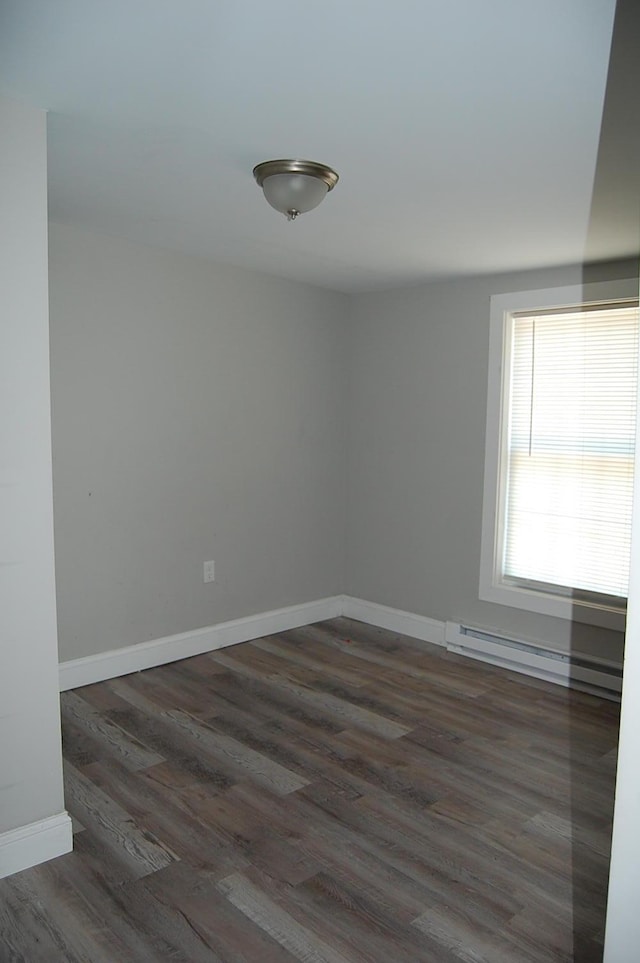 30 Westland Ave, Biddeford, ME 04005 - empty room featuring wood finished floors, baseboard heating, and baseboards