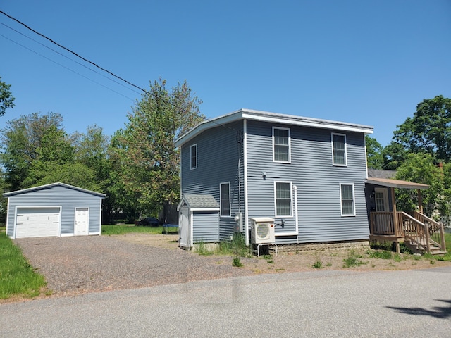 30 Westland Ave, Biddeford, ME 04005 - view of side of home with an outdoor structure and a garage